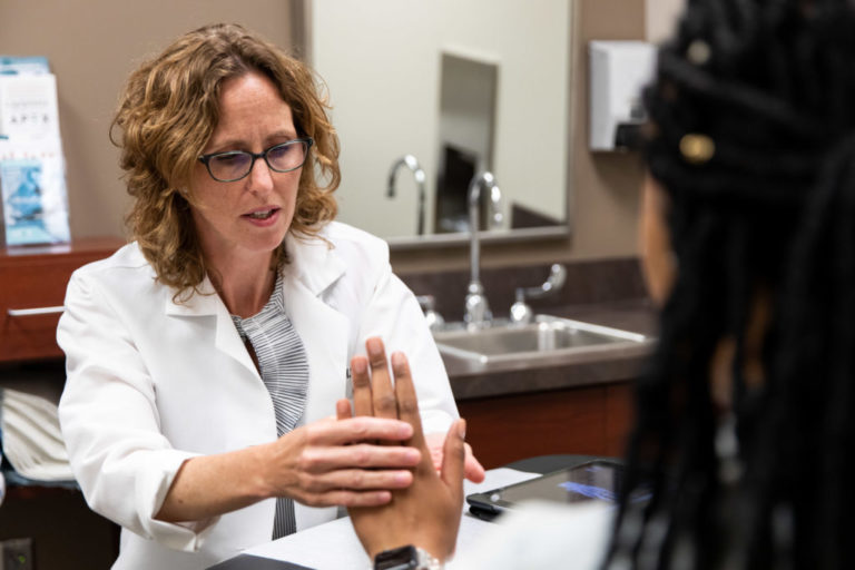KCOA provider discussing carpal tunnel treatments in Blue Springs.