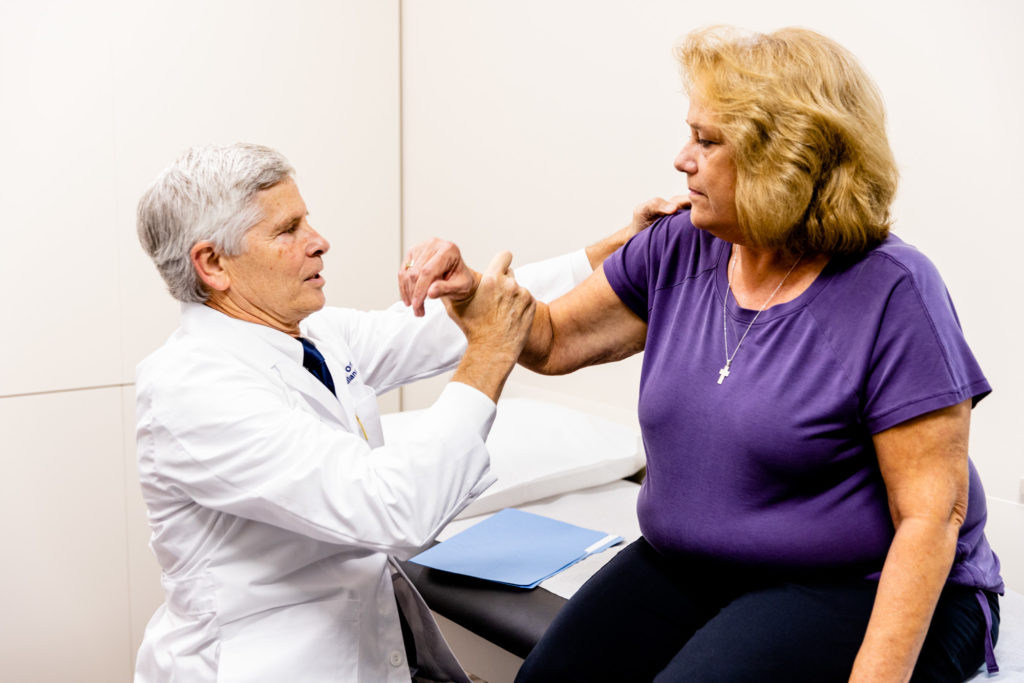 Physician providing rotator cuff treatment in Kansas City