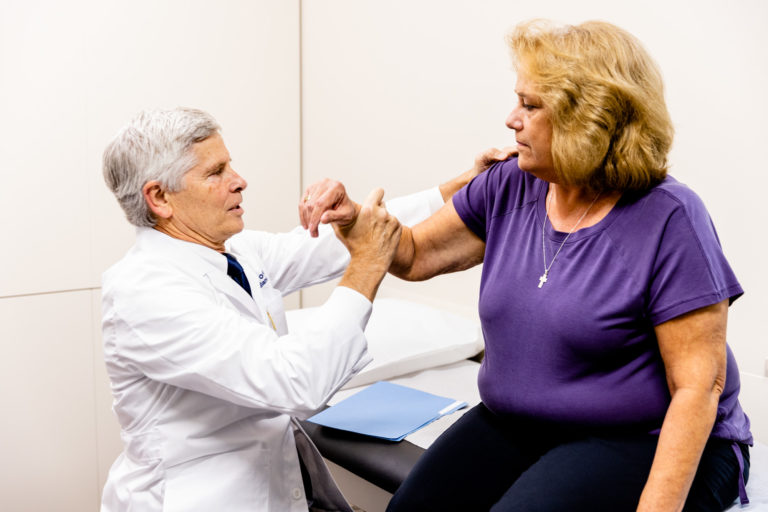 Physician providing rotator cuff treatment in Kansas City