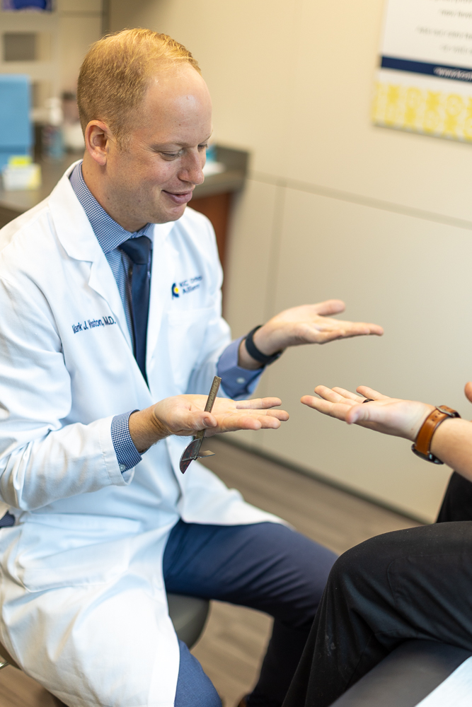 One of our Physiatrists in Kansas City providing wrist pain treatment in Kansas City