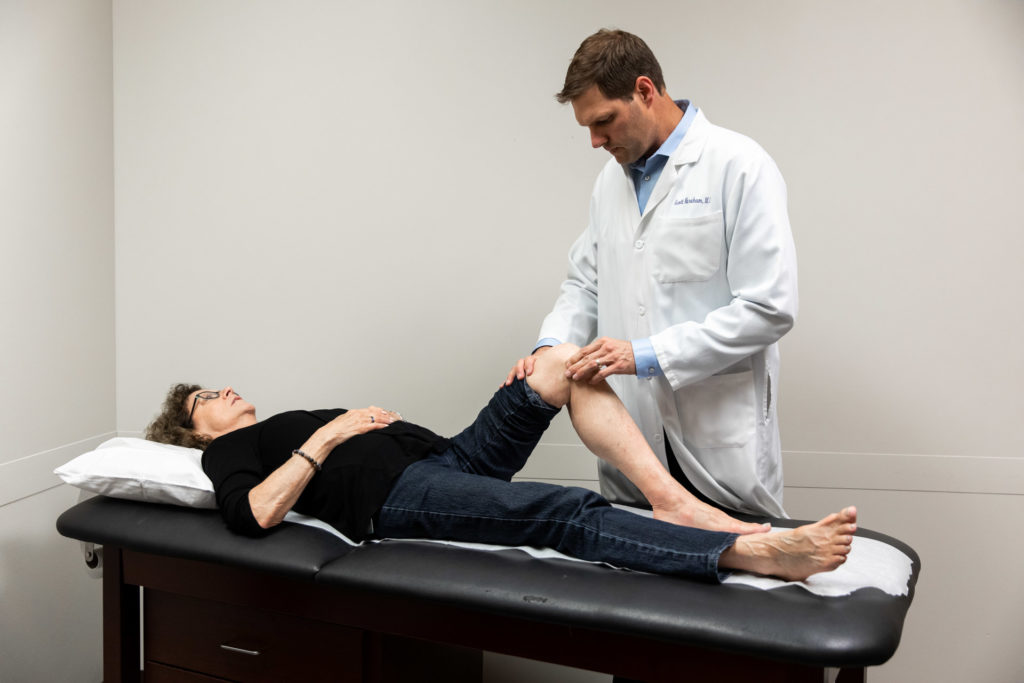 KCOA provider evaluating patient's knee to determine if meniscus surgery in Kansas City is necessary